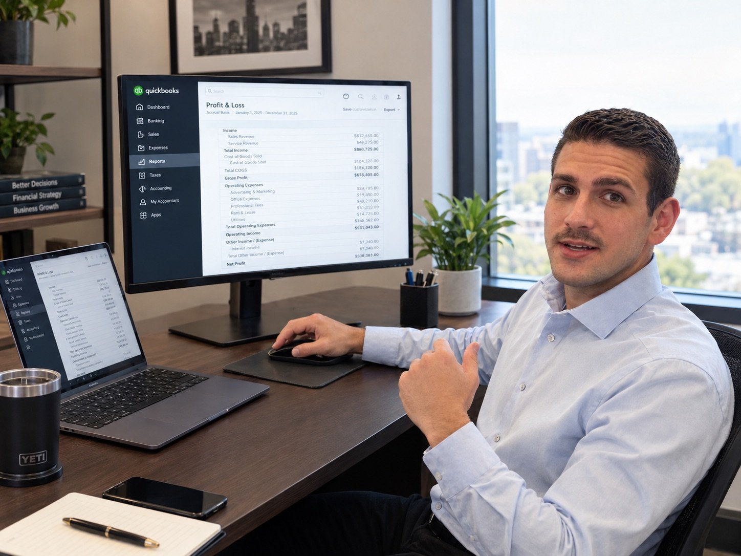 Gabriel Bagnoli reviewing a Profit and Loss report in QuickBooks Online at his desk